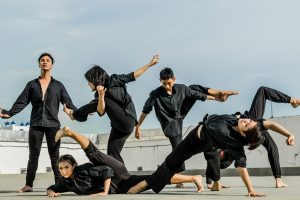 martial arts practitioners in black robes